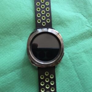 Samsung Black and Silver Smartwatch with Green Accents